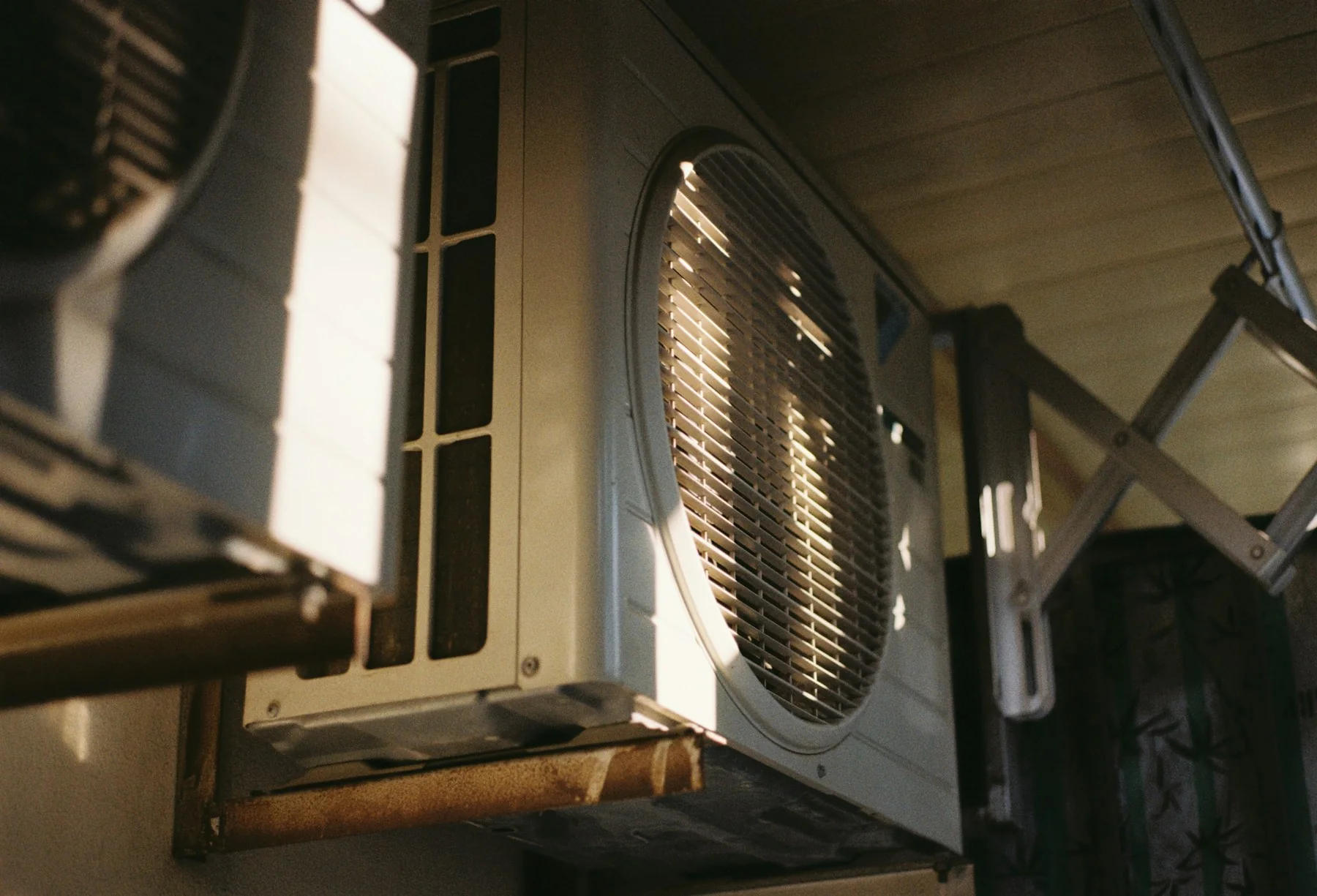 Outdoor heating and cooling equipment beside a building
