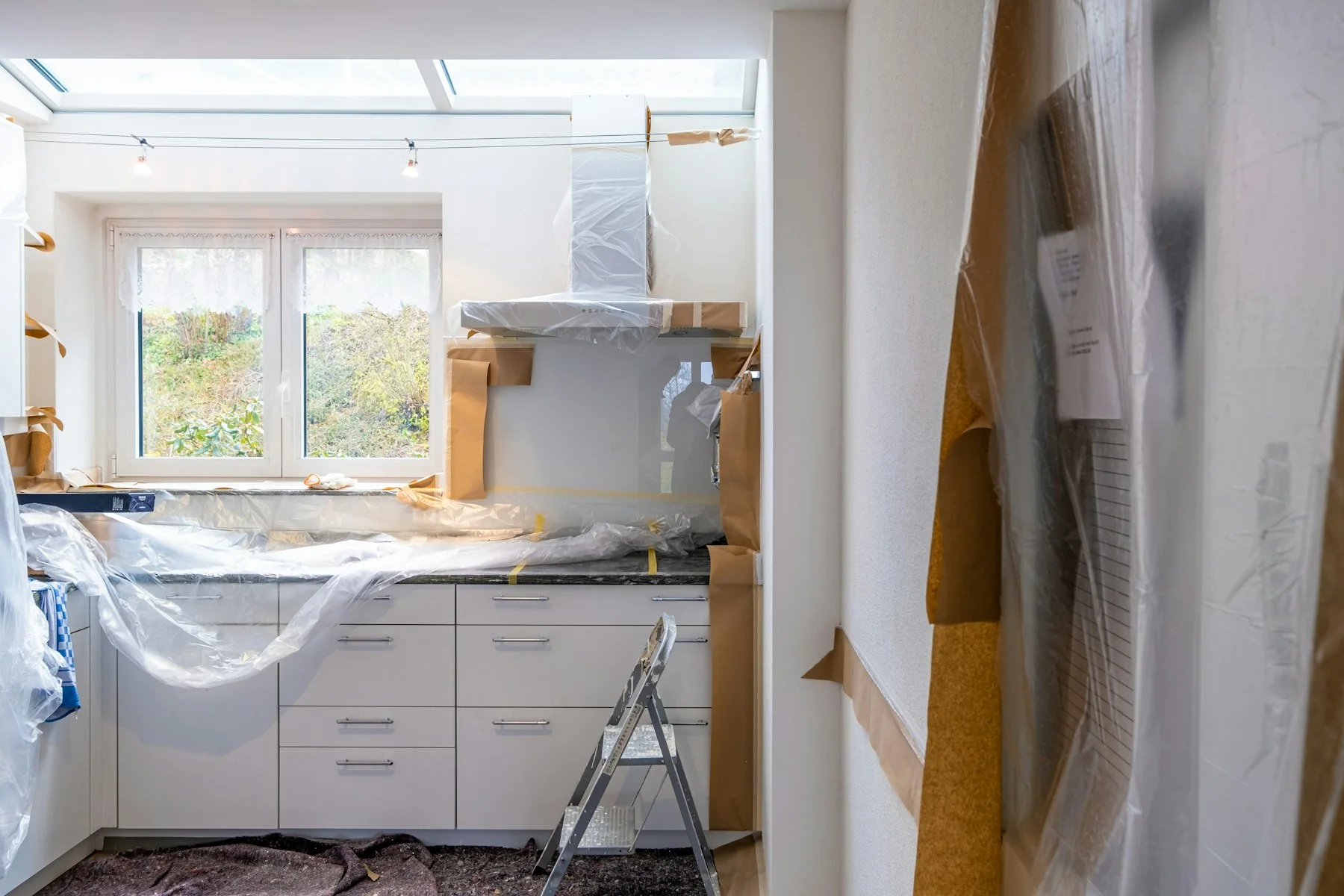 Kitchen renovation with cabinetry installation in progress